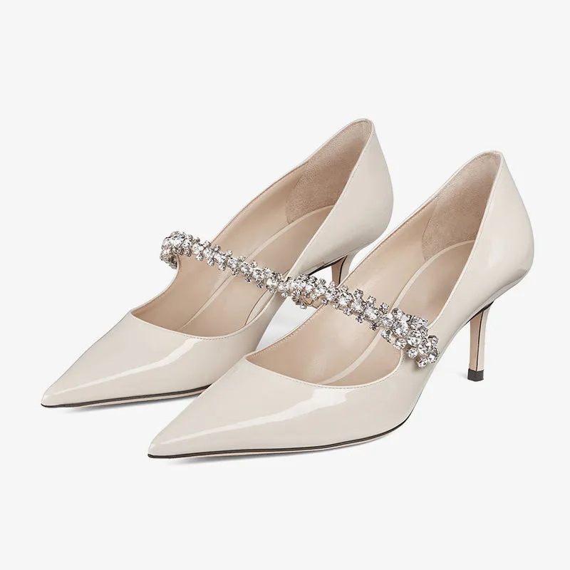 Crystal-Embellished Patent Leather Pumps sold by ArnoConti