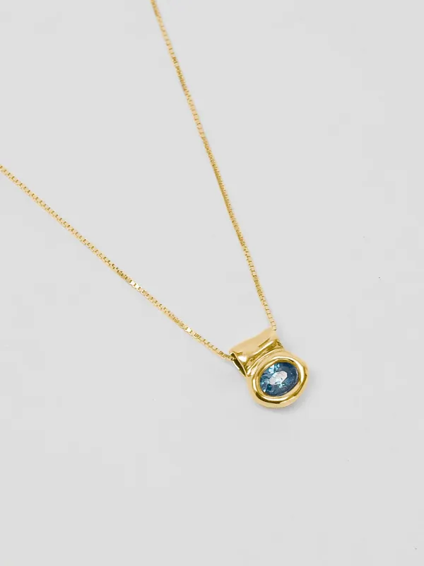 Cora Necklace in Blue Topaz and Gold sold by Wolf Circus