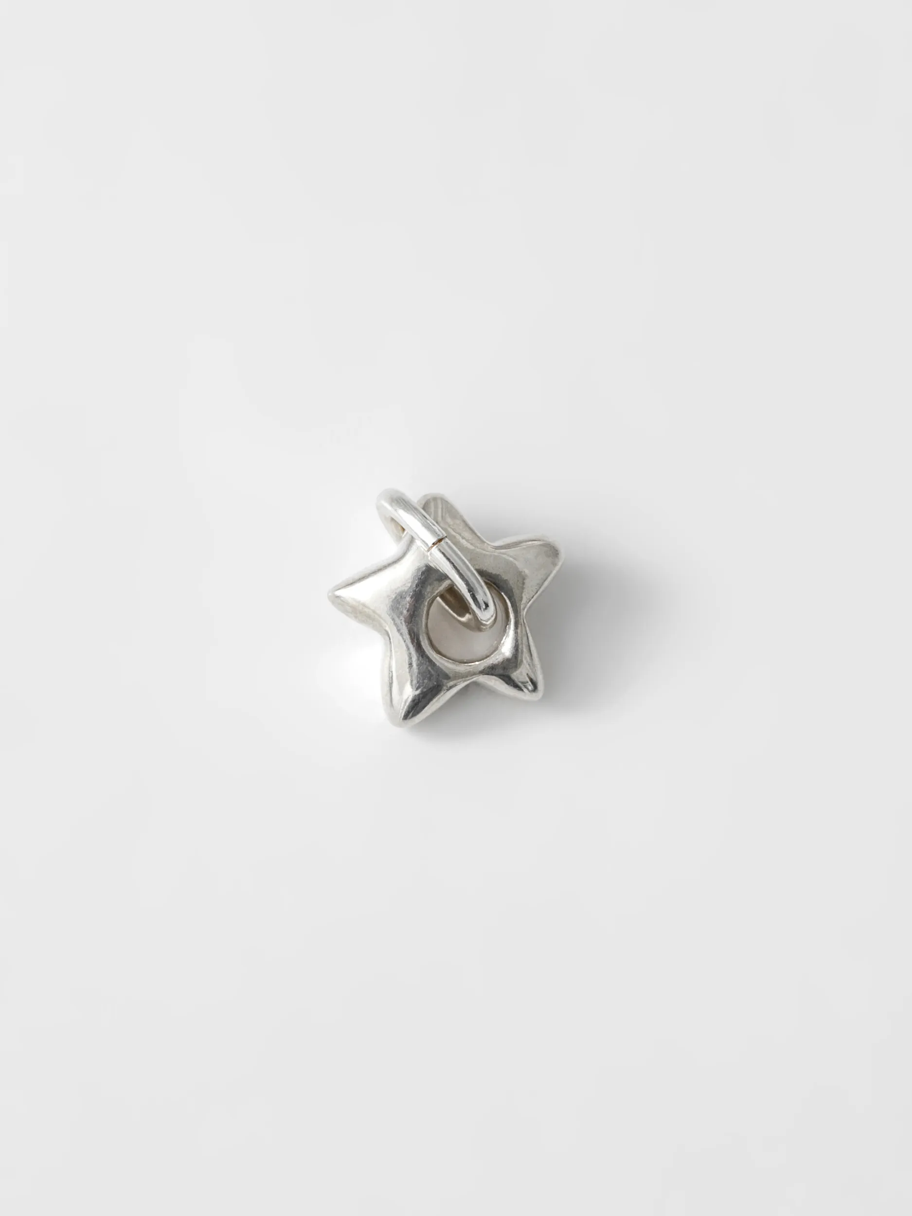 Mini Star Charm in Sterling Silver sold by Wolf Circus