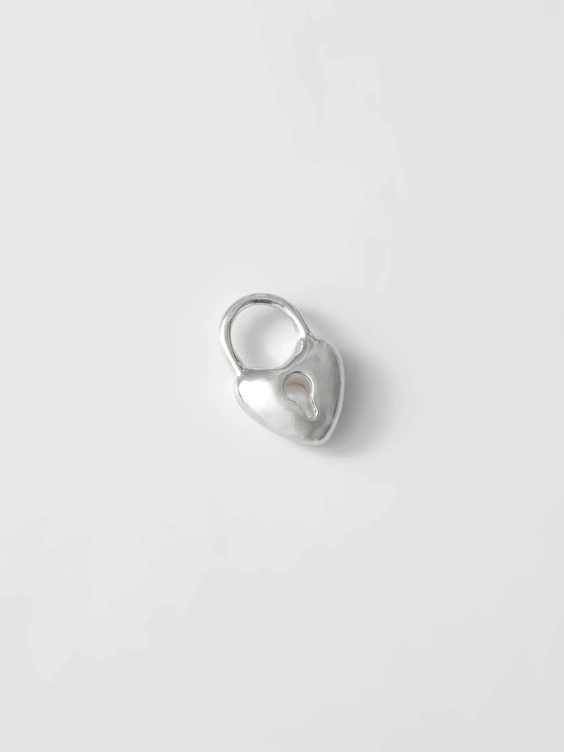 Mini Heart Lock Charm in Sterling Silver sold by Wolf Circus