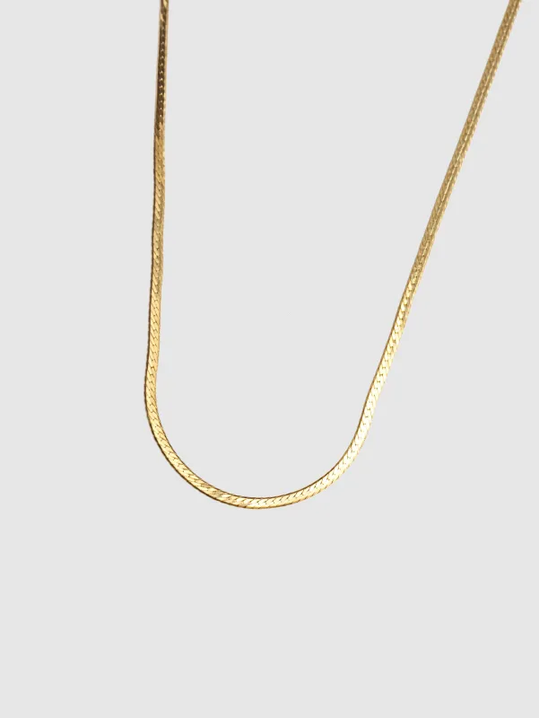 Thin Herringbone Chain in Gold sold by Wolf Circus