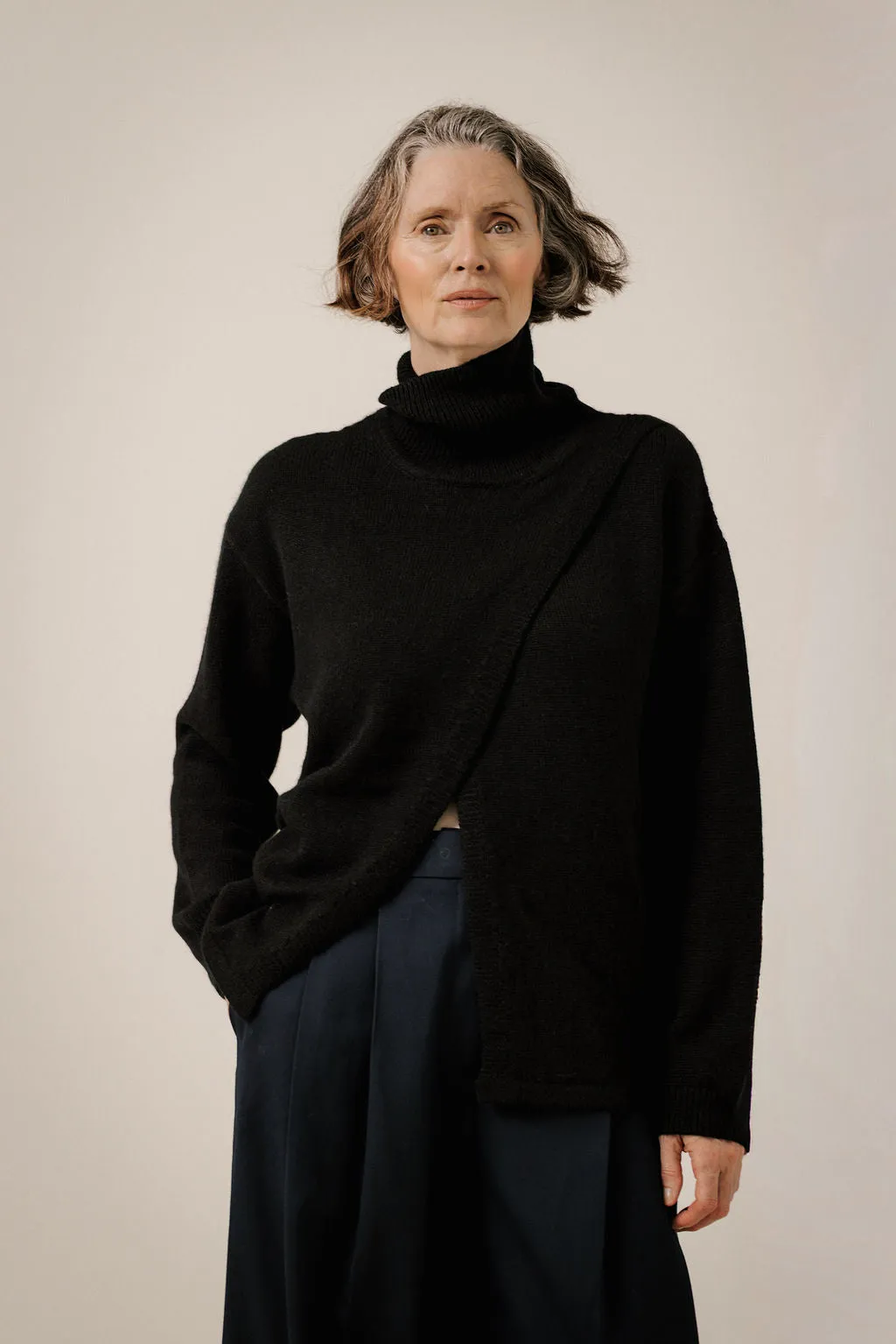Asymmetric Funnel Neck in Classic Black sold by Bare Knitwear