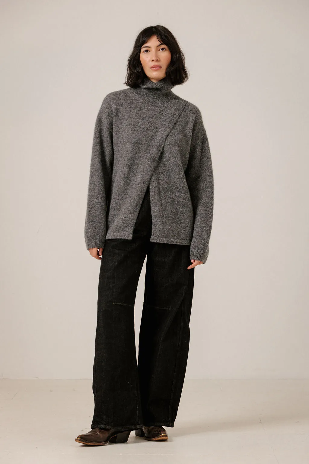Asymmetric Funnel Neck in Charcoal sold by Bare Knitwear