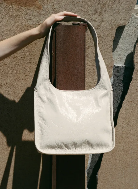 Clara in Crinkle Patent Stone sold by Are Studio