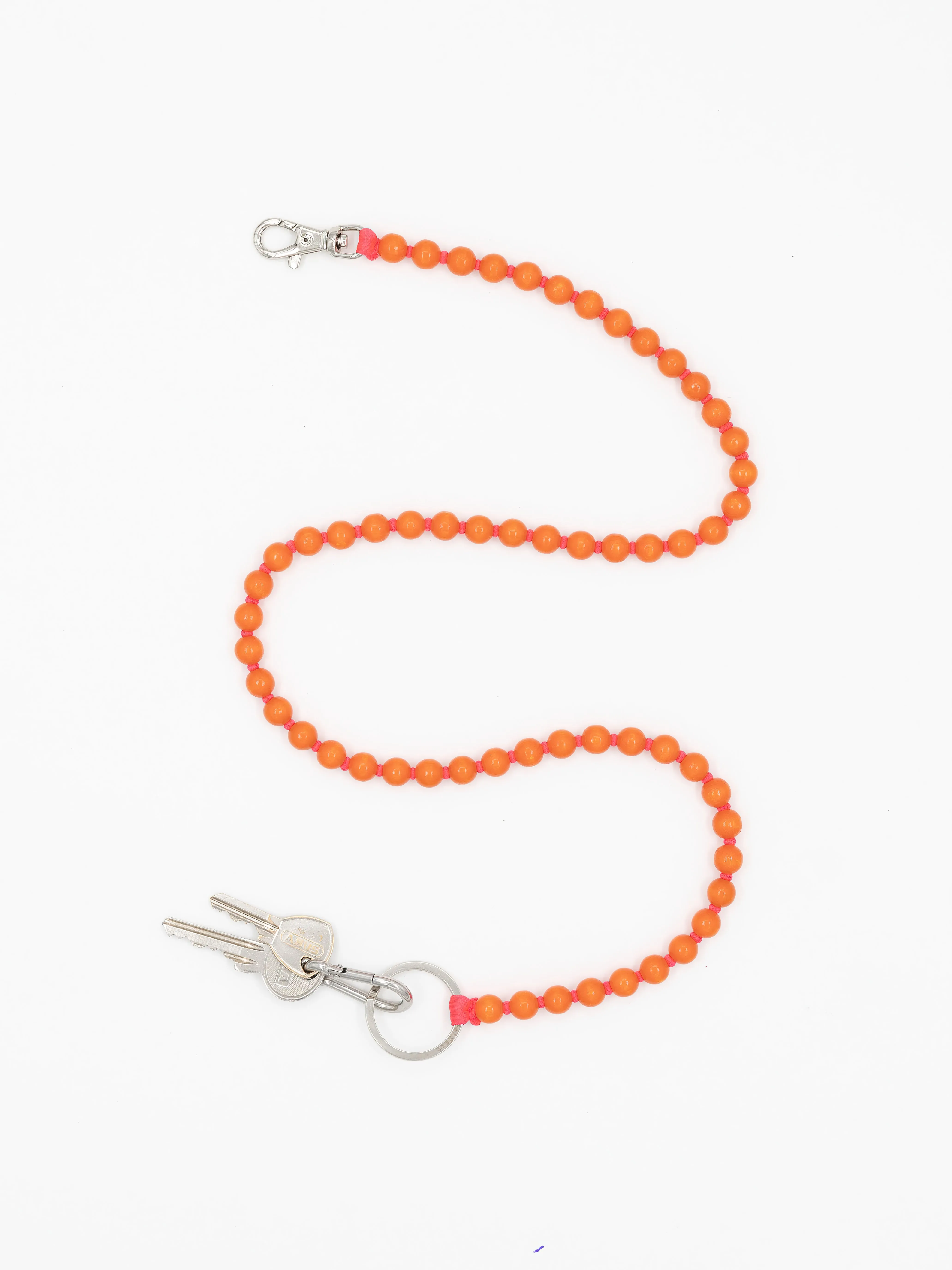 Perlen long, orange-red sold by Ina.seifart