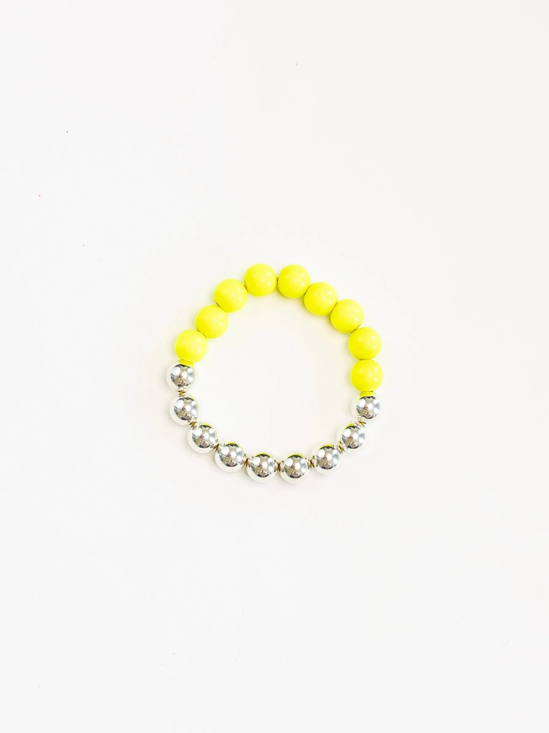 Perlen silver/wood bracelet, neonyellow sold by Ina.seifart