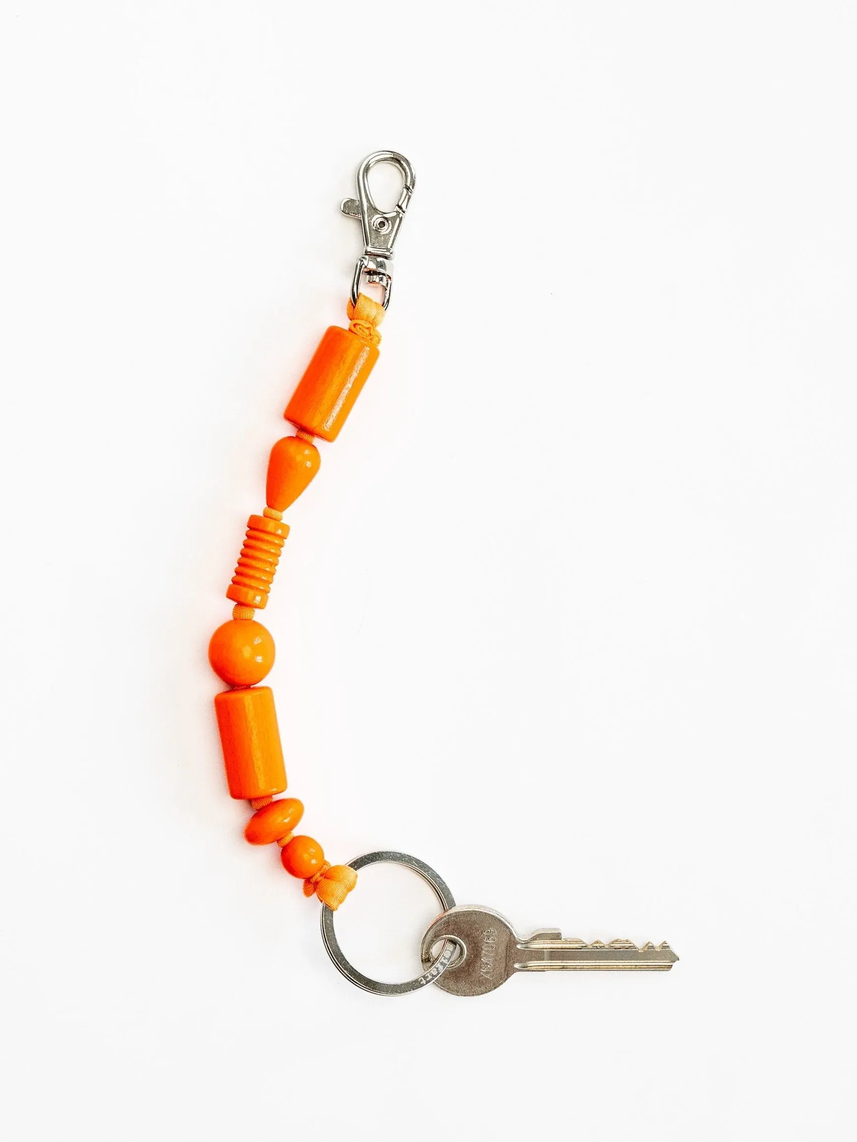 Perlenmix short, neonorange sold by Ina.seifart