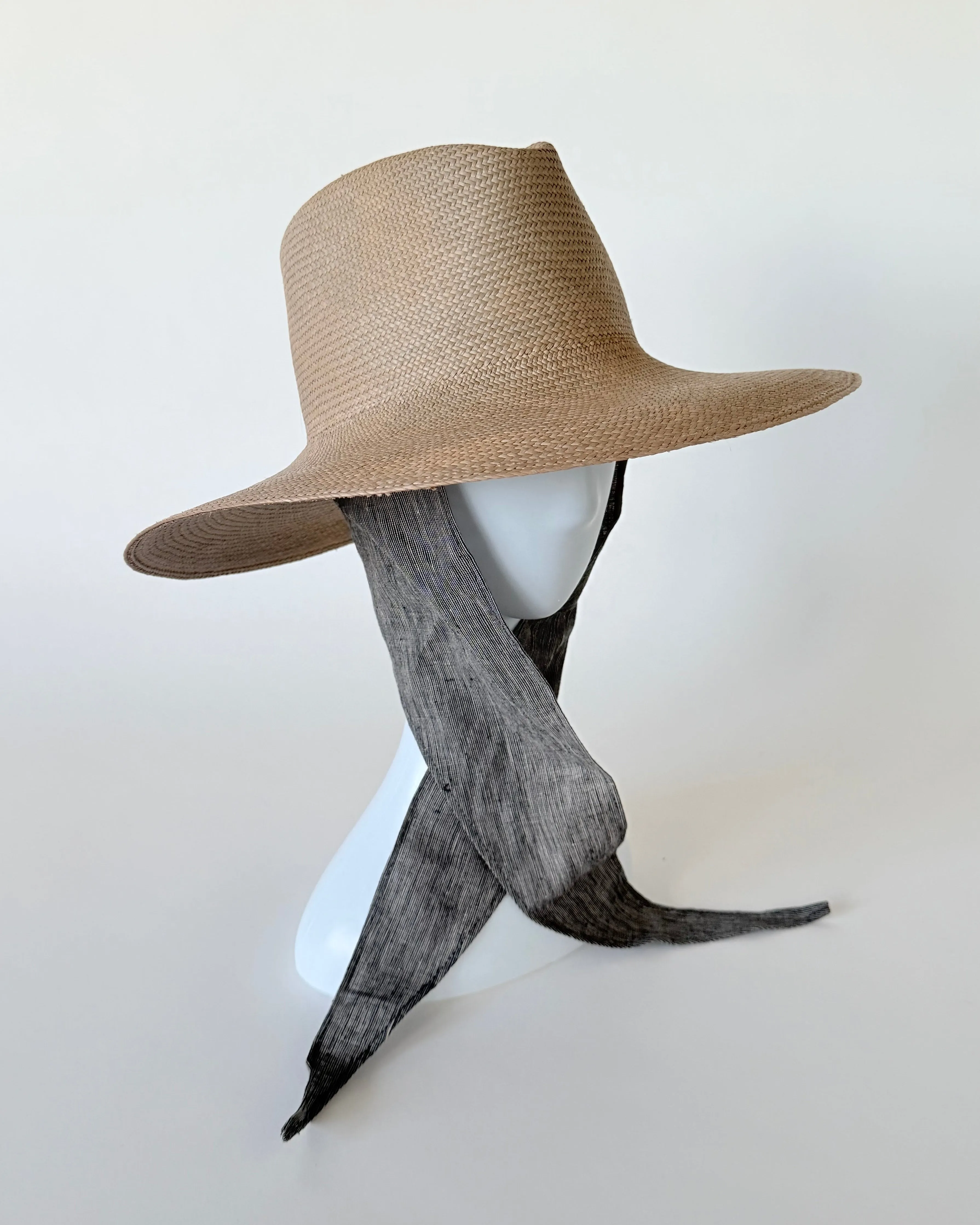 Caro Hat in Grey Toquilla Straw sold by CLYDE