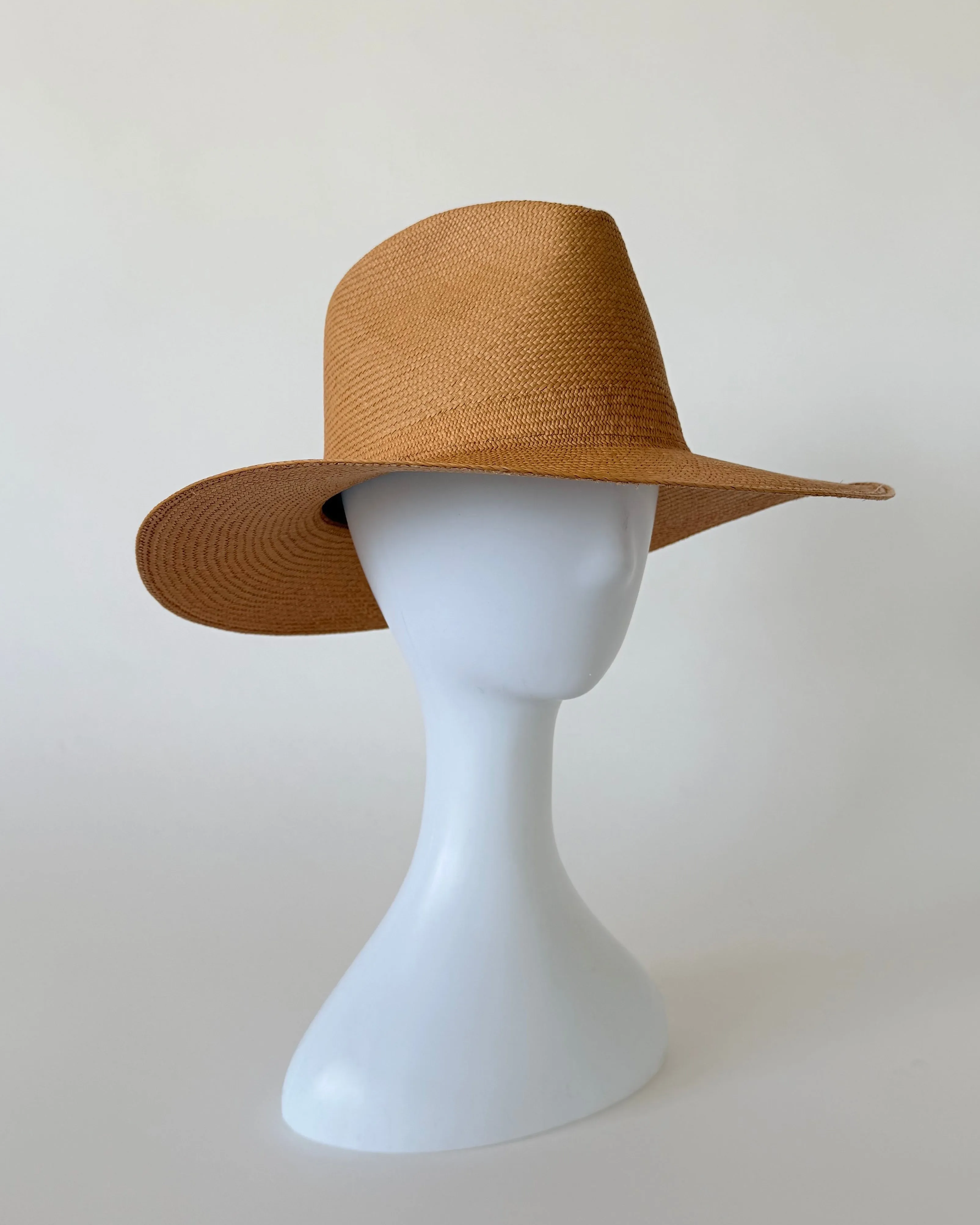 Caro Hat in Caramel Toquilla Straw sold by CLYDE