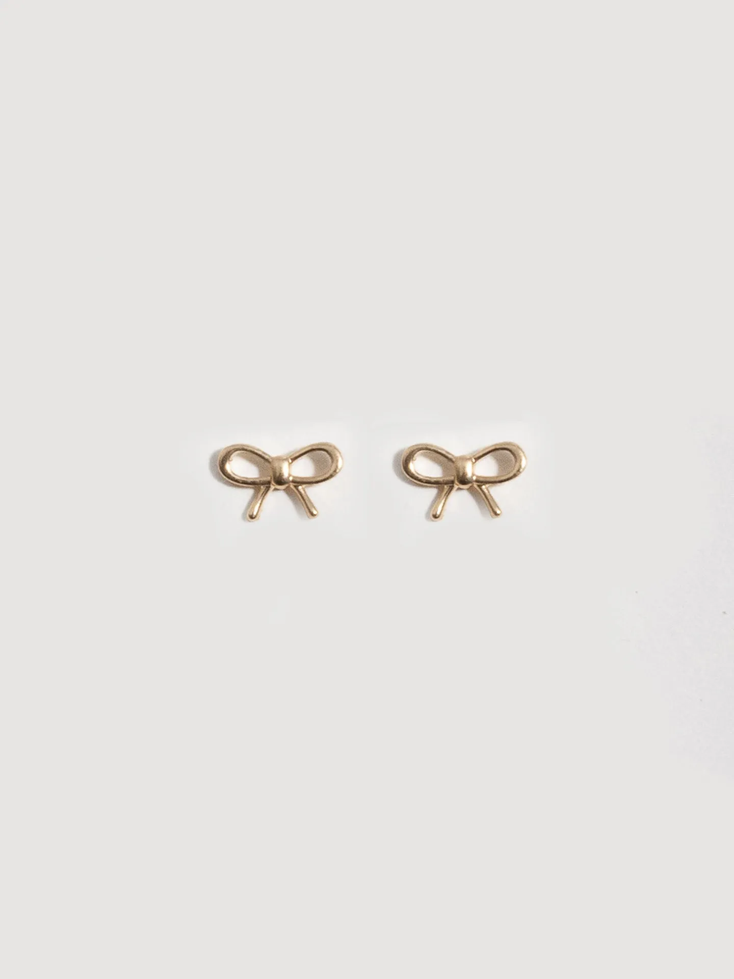 Mini Bow Studs sold by Loren Stewart