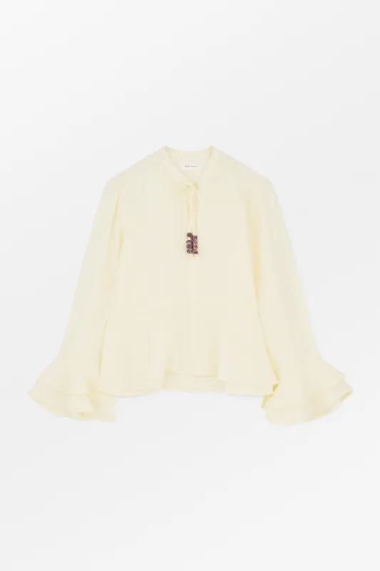 Frigga flounce shirt - Buttermilk sold by Skall Studio