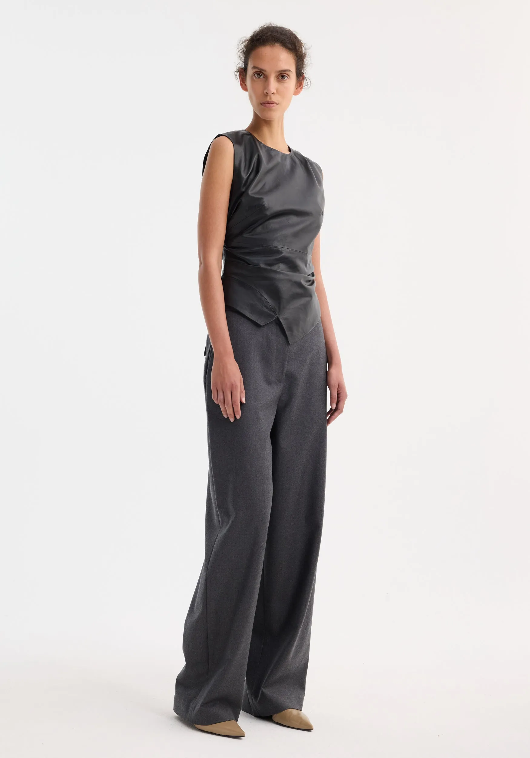 Sleeveless draped leather top | black sold by Rohe
