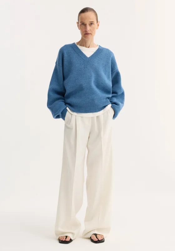 V-neck knitted jumper | denim blue melange sold by Rohe