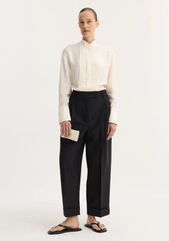 High-waist turn-up trousers | black made by Rohe