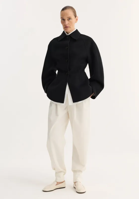 Double-faced sculptural jacket | black sold by Rohe