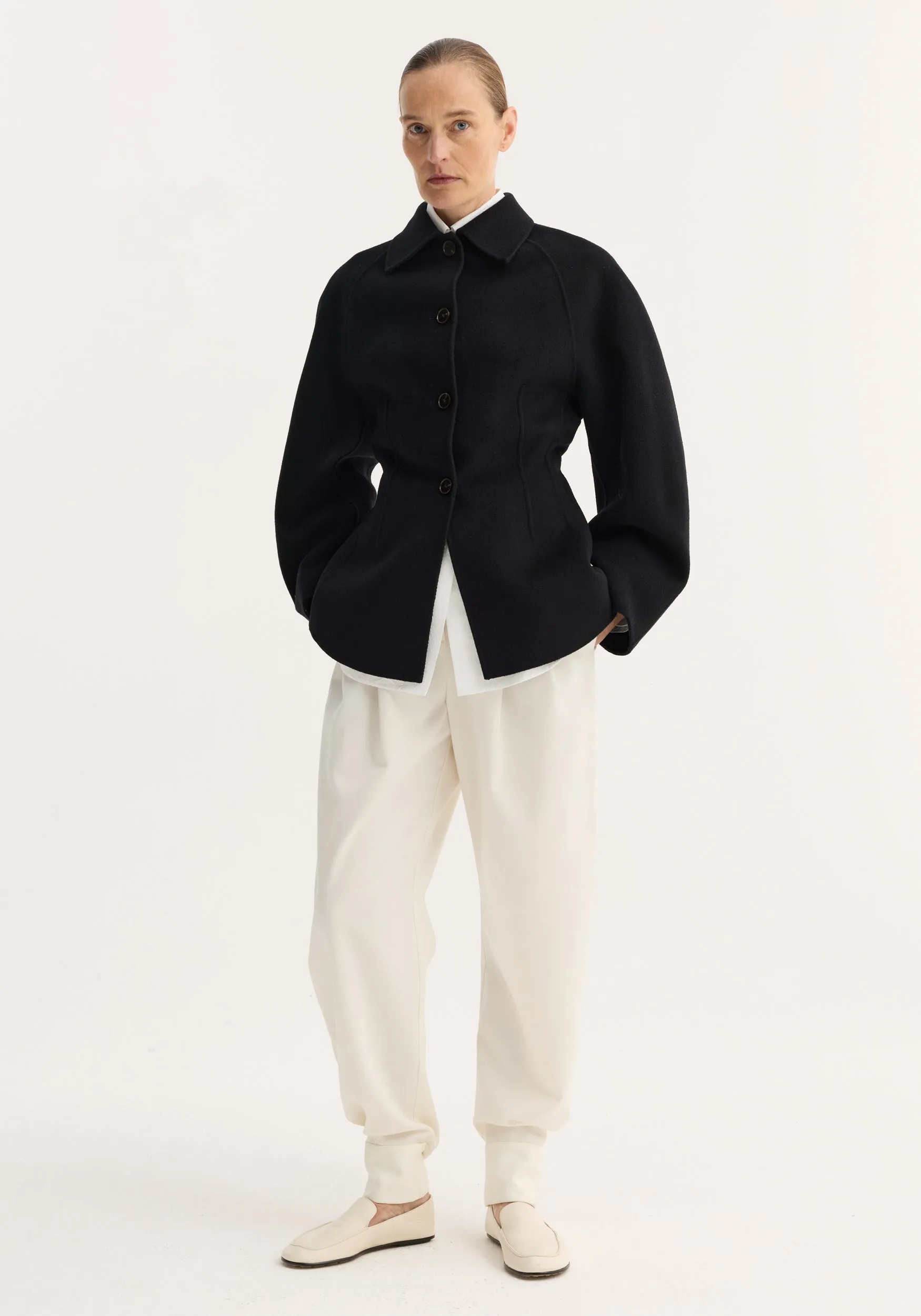 Double-faced sculptural jacket | black sold by Rohe
