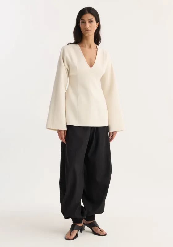 Sculptural long sleeve top | off white made by Rohe
