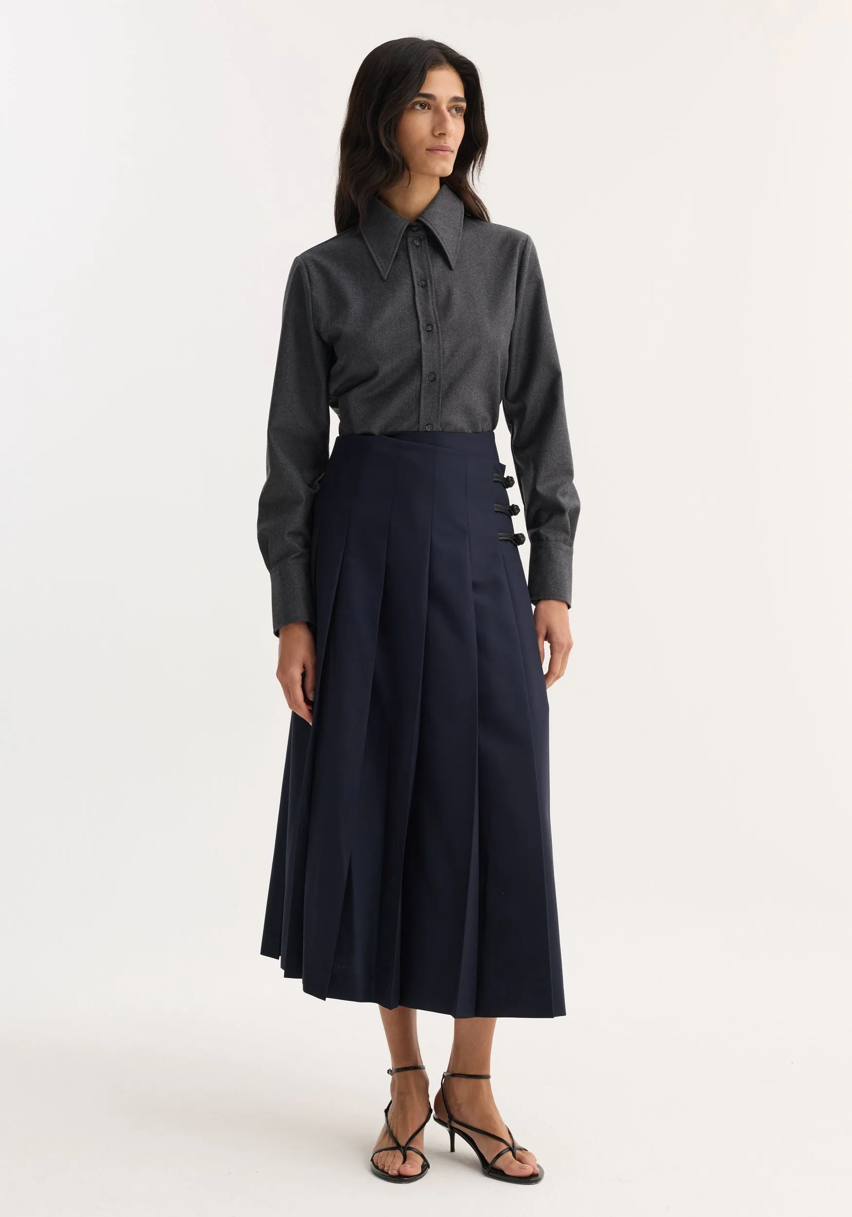Pleated wool skirt with leather closures | navy sold by Rohe