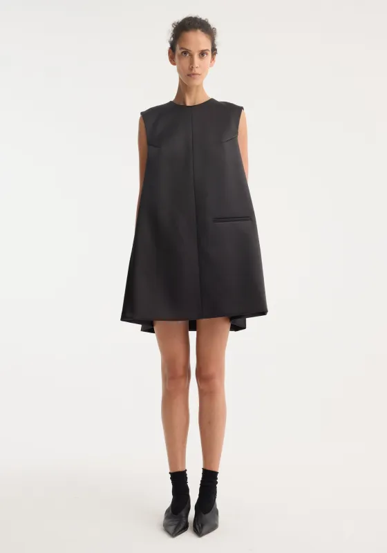 Sculptural cape dress | black made by Rohe