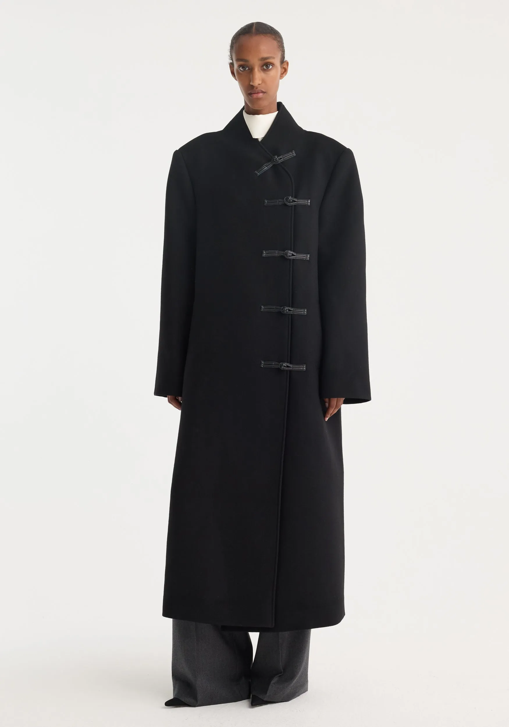 Mandarin wool coat | black sold by Rohe