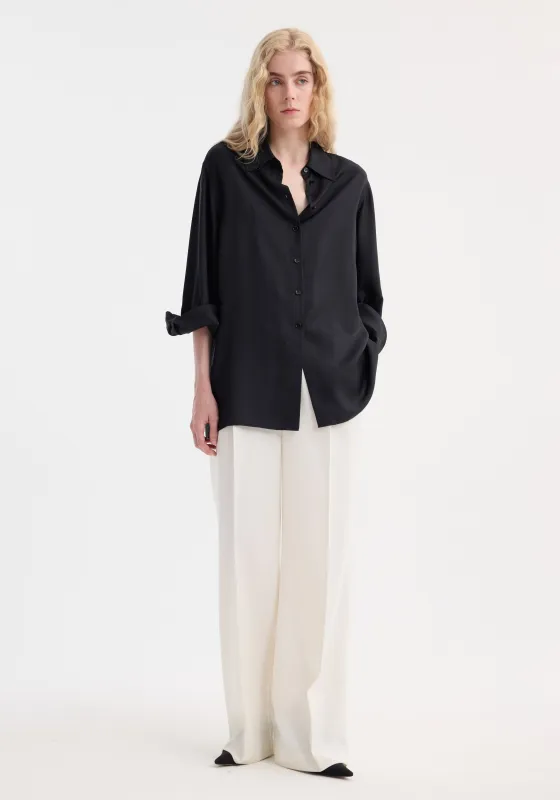 Deconstructed silk shirt | black sold by Rohe