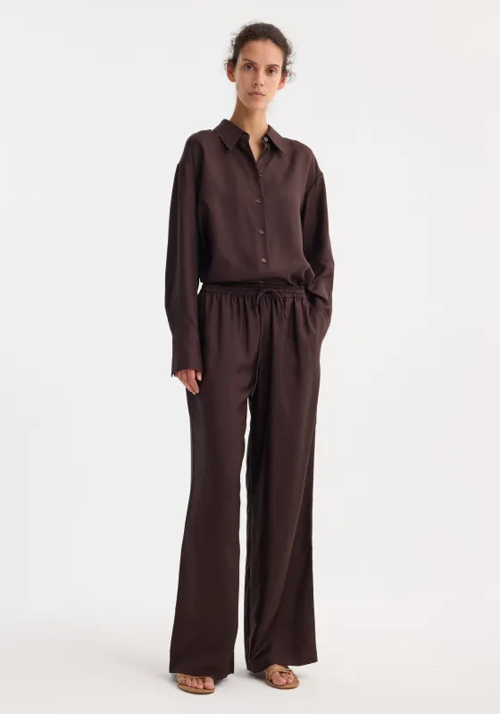 Wide leg silk trousers | mahogany sold by Rohe