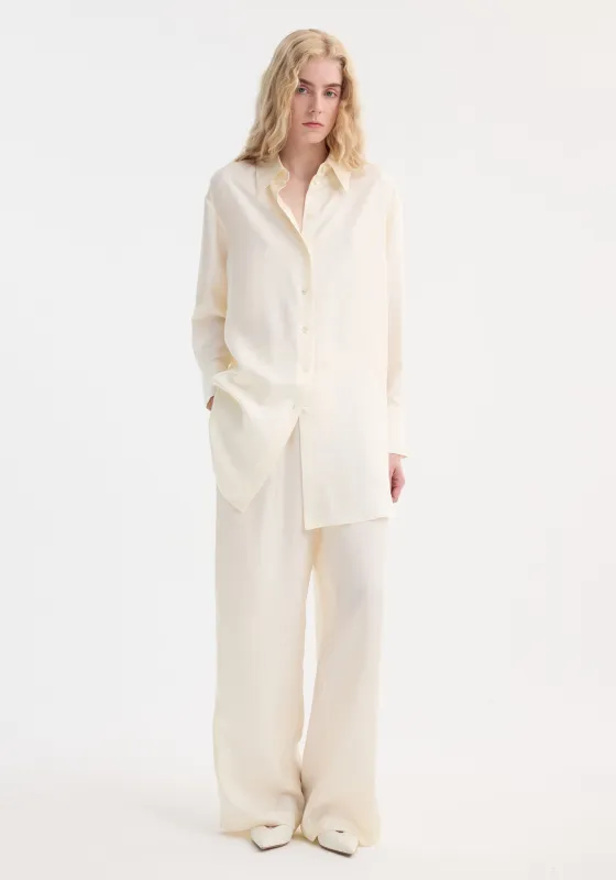 Signature elongated silk shirt | cream sold by Rohe