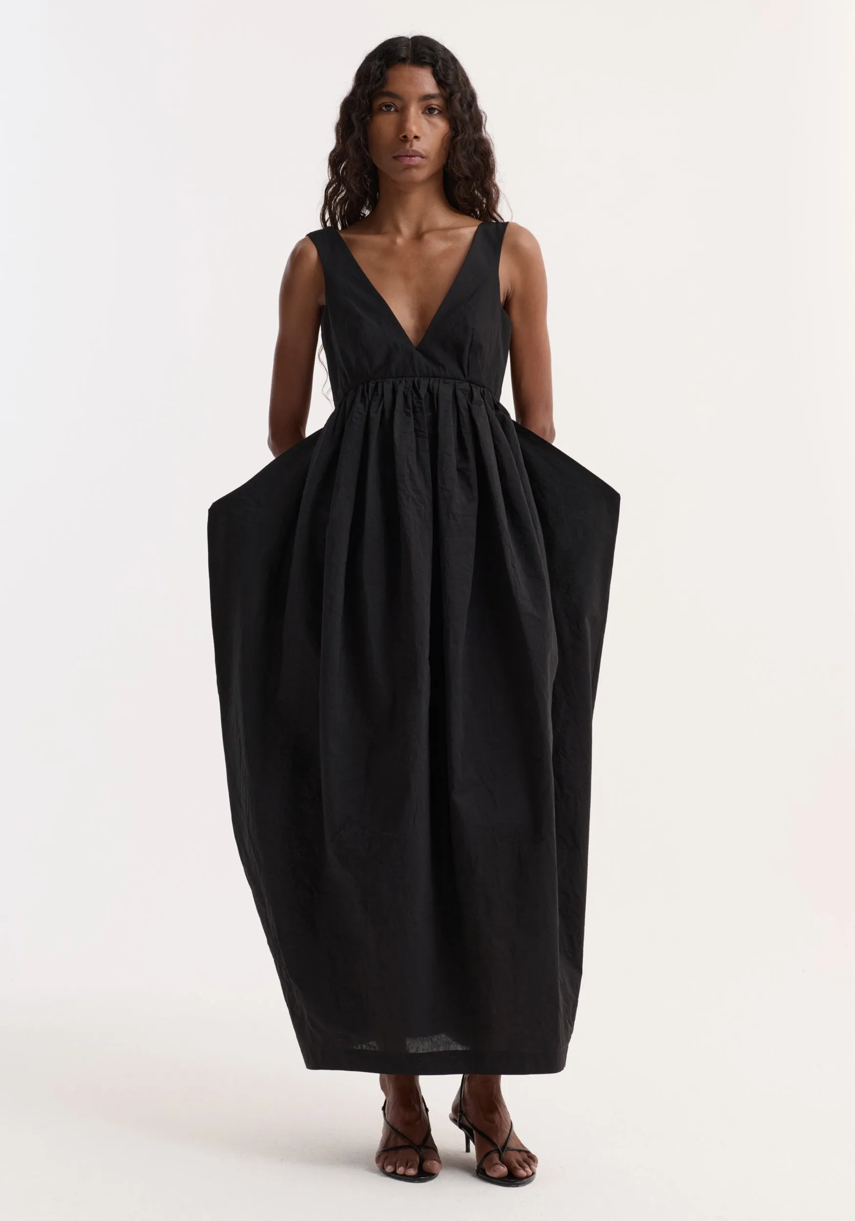 Sculptural textured cotton dress | black sold by Rohe
