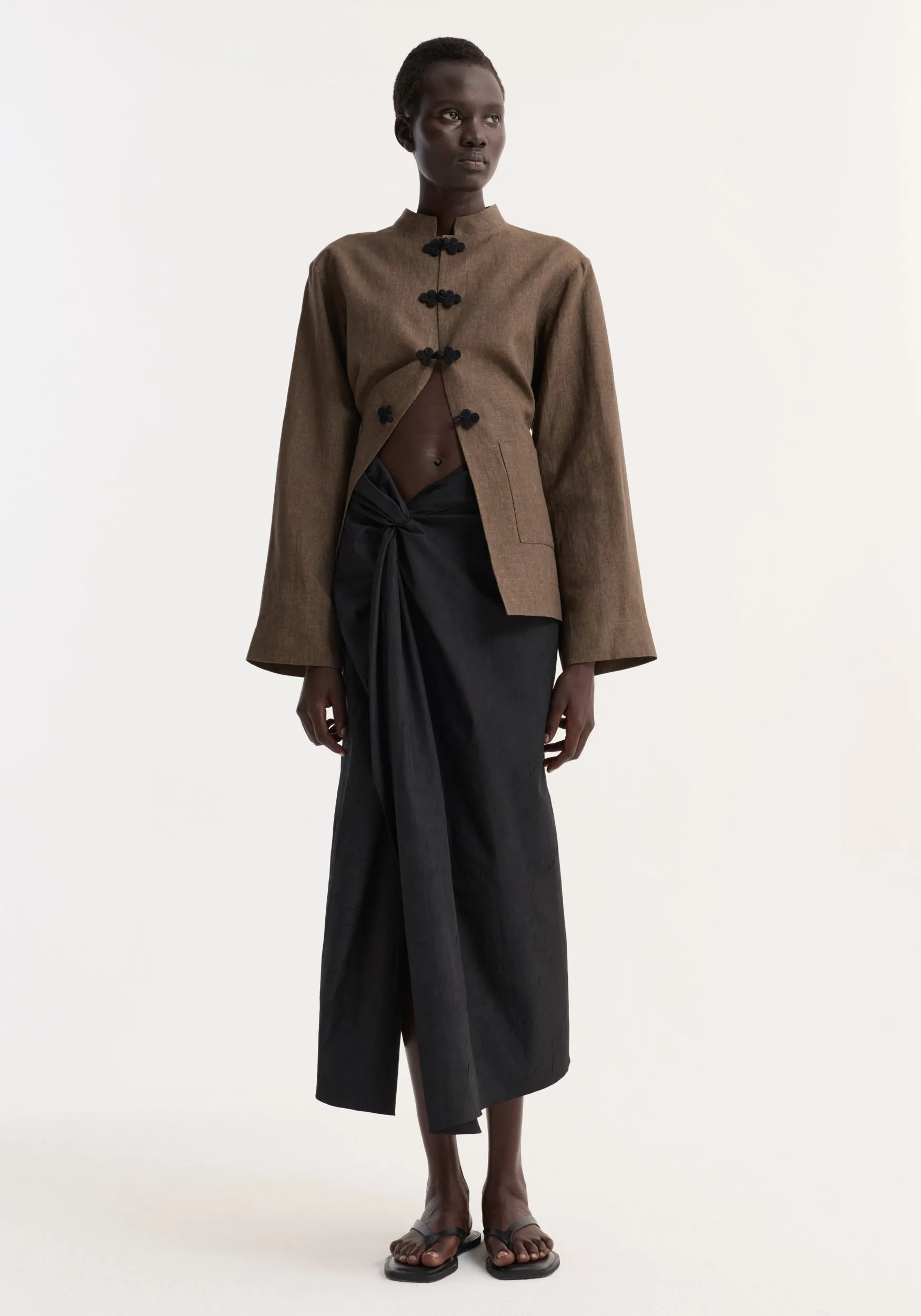 Sarong textured skirt | black sold by Rohe