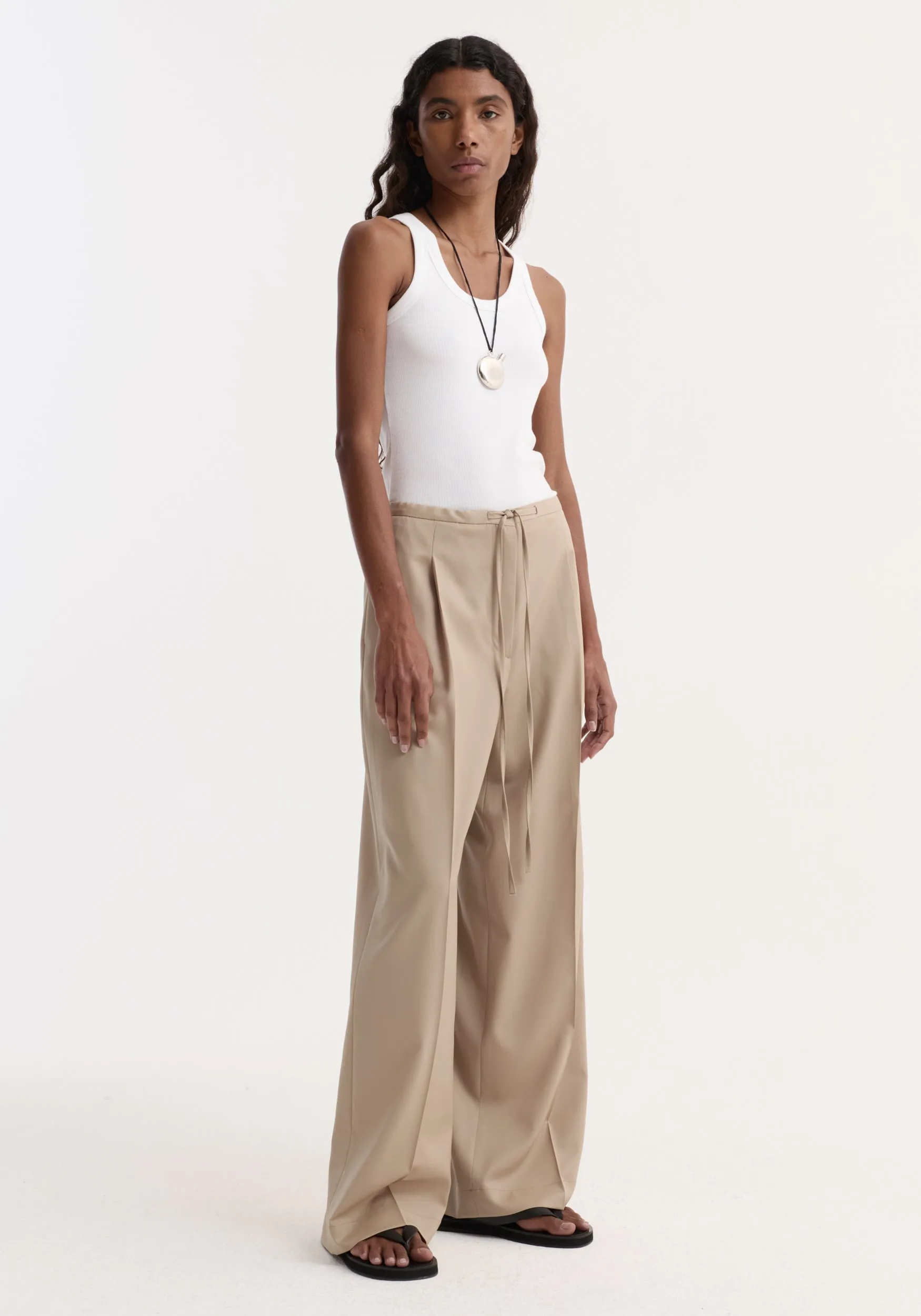 Relaxed drawstring trousers | beige sold by Rohe