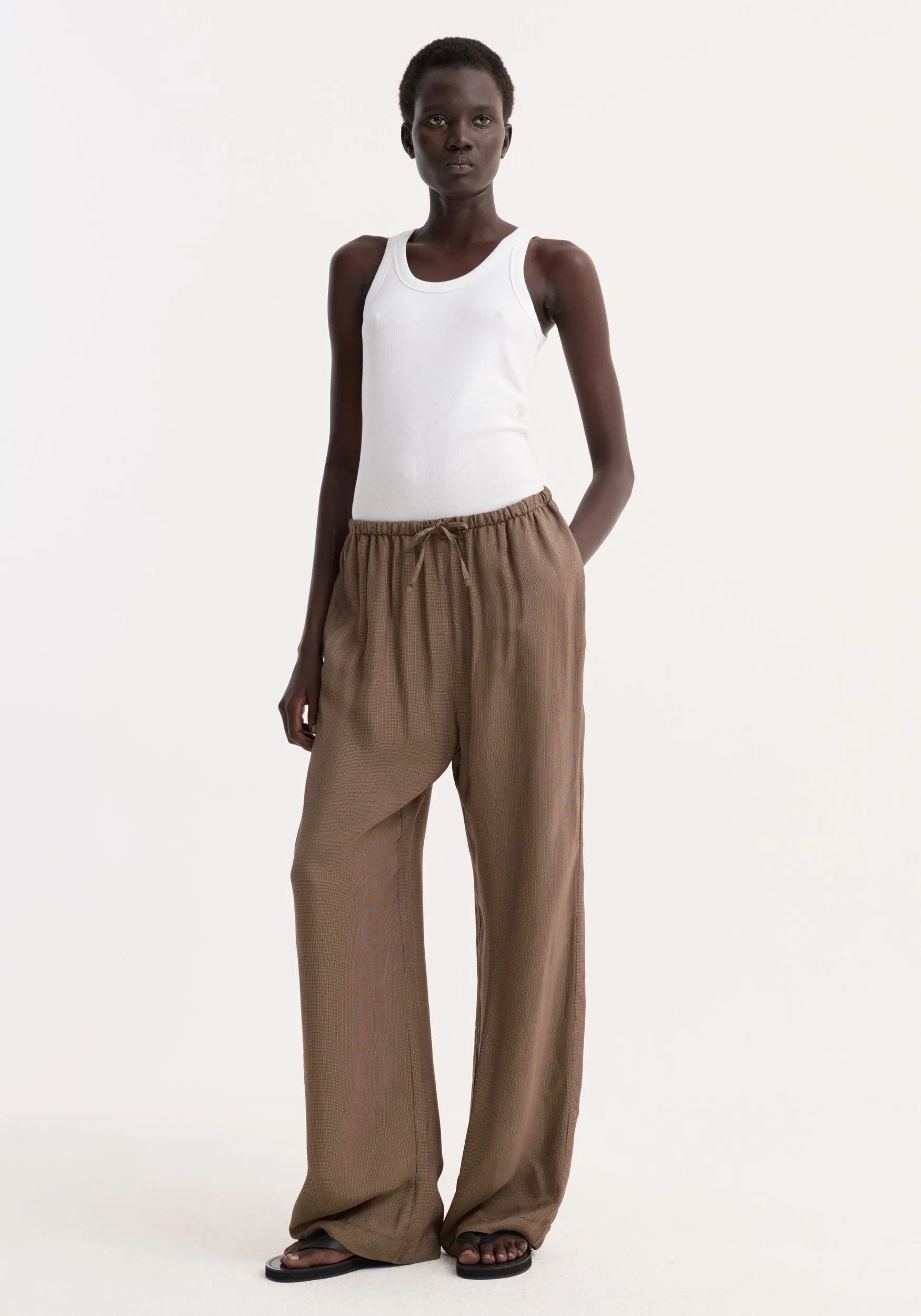 Relaxed fit trousers | brown mini check sold by Rohe