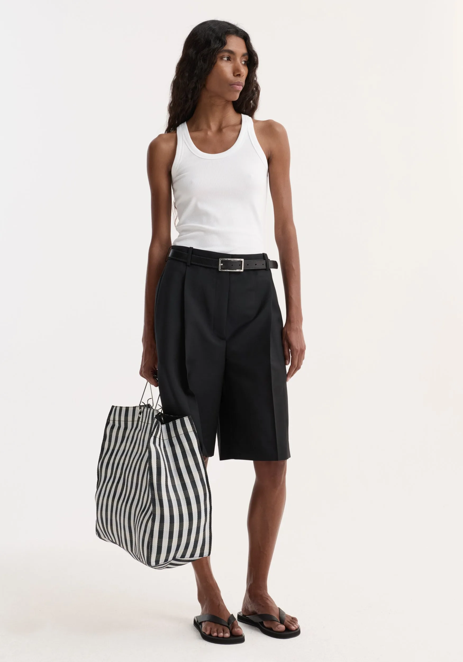 Tailored single pleat shorts | black sold by Rohe