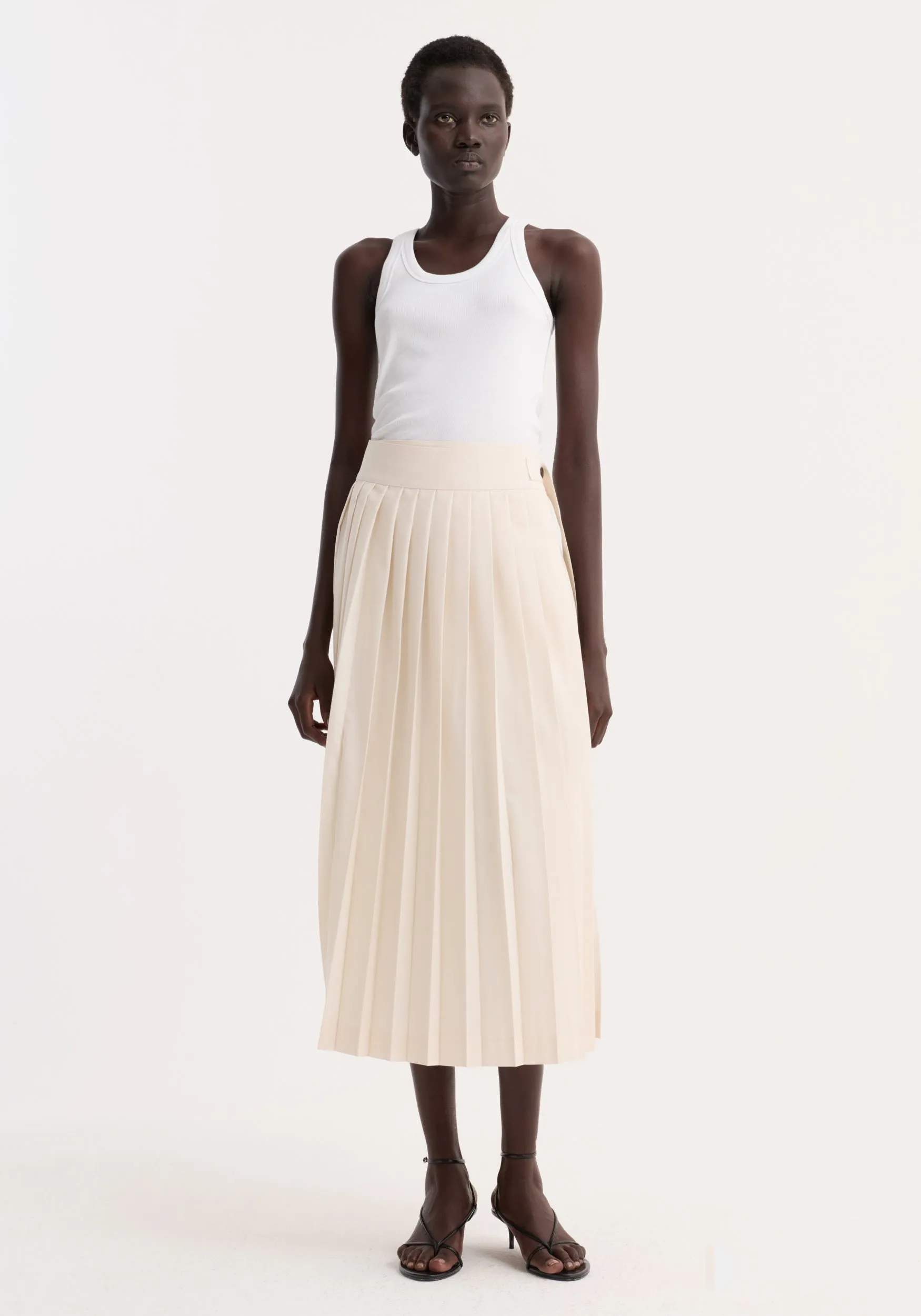 Plissé wrap skirt | cream sold by Rohe