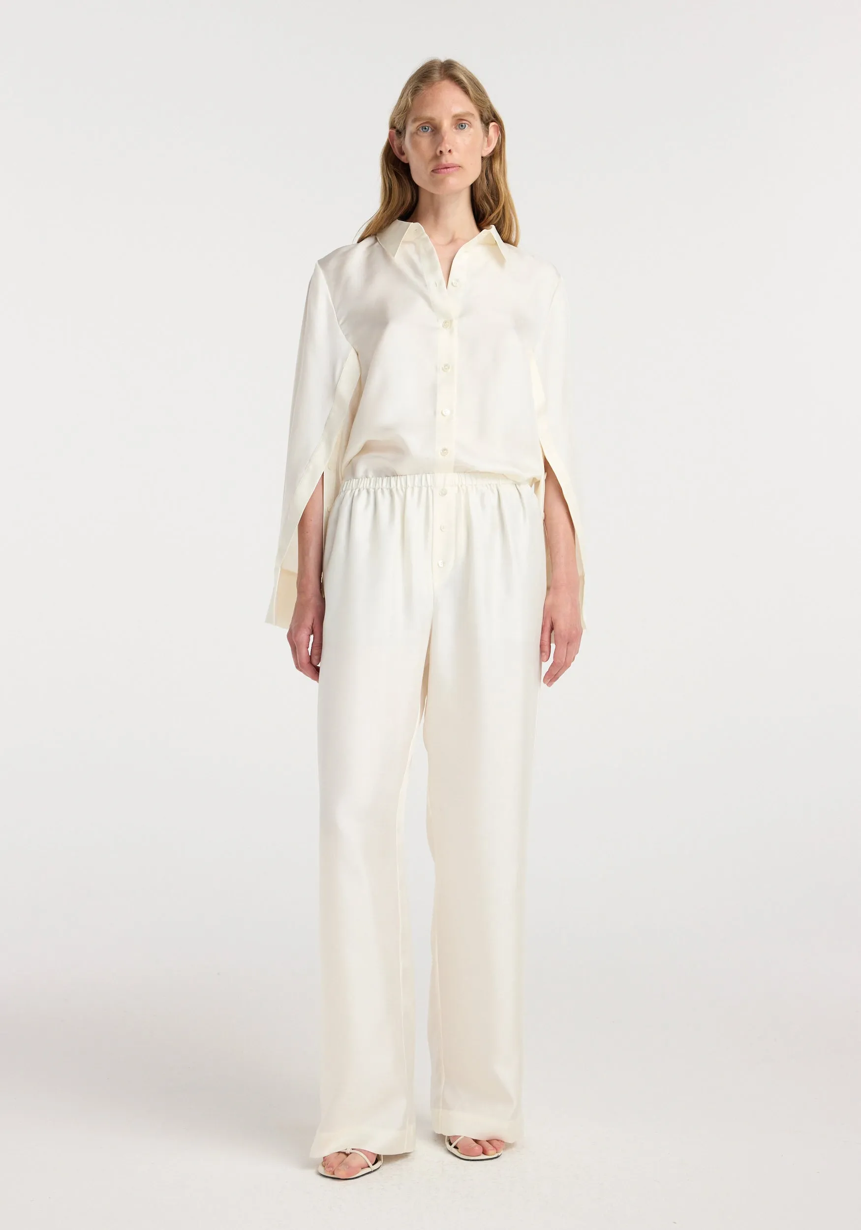 Silk relaxed trousers | cream sold by Rohe