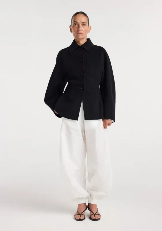 Double-faced sculptural jacket | black made by Rohe