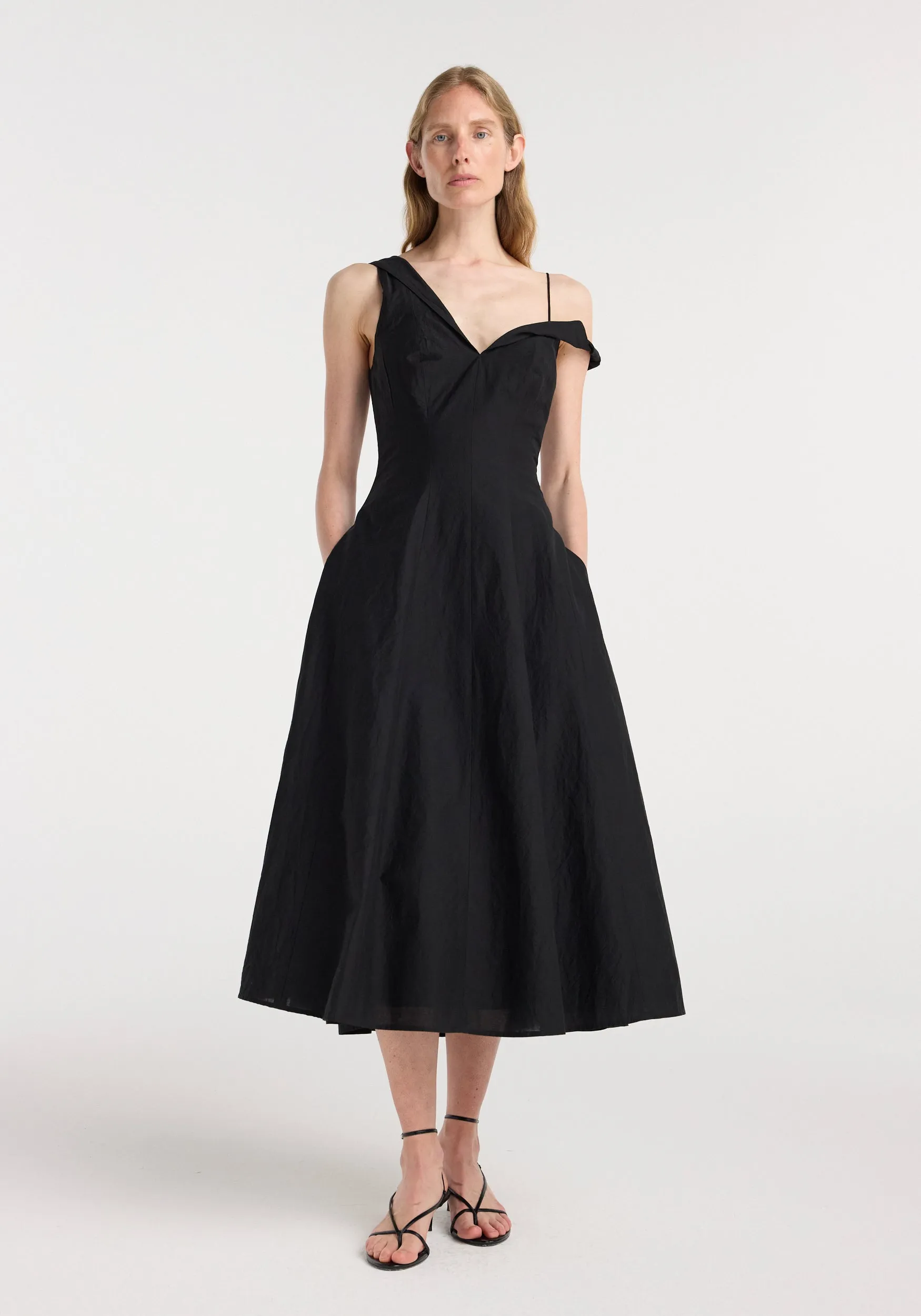 Twisted shoulder dress | black sold by Rohe