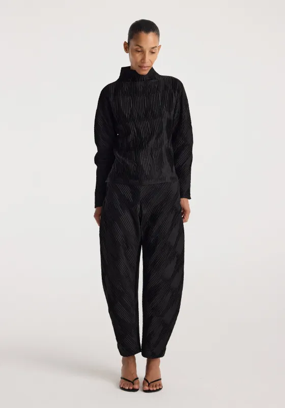 Plissé satin trousers | black made by Rohe