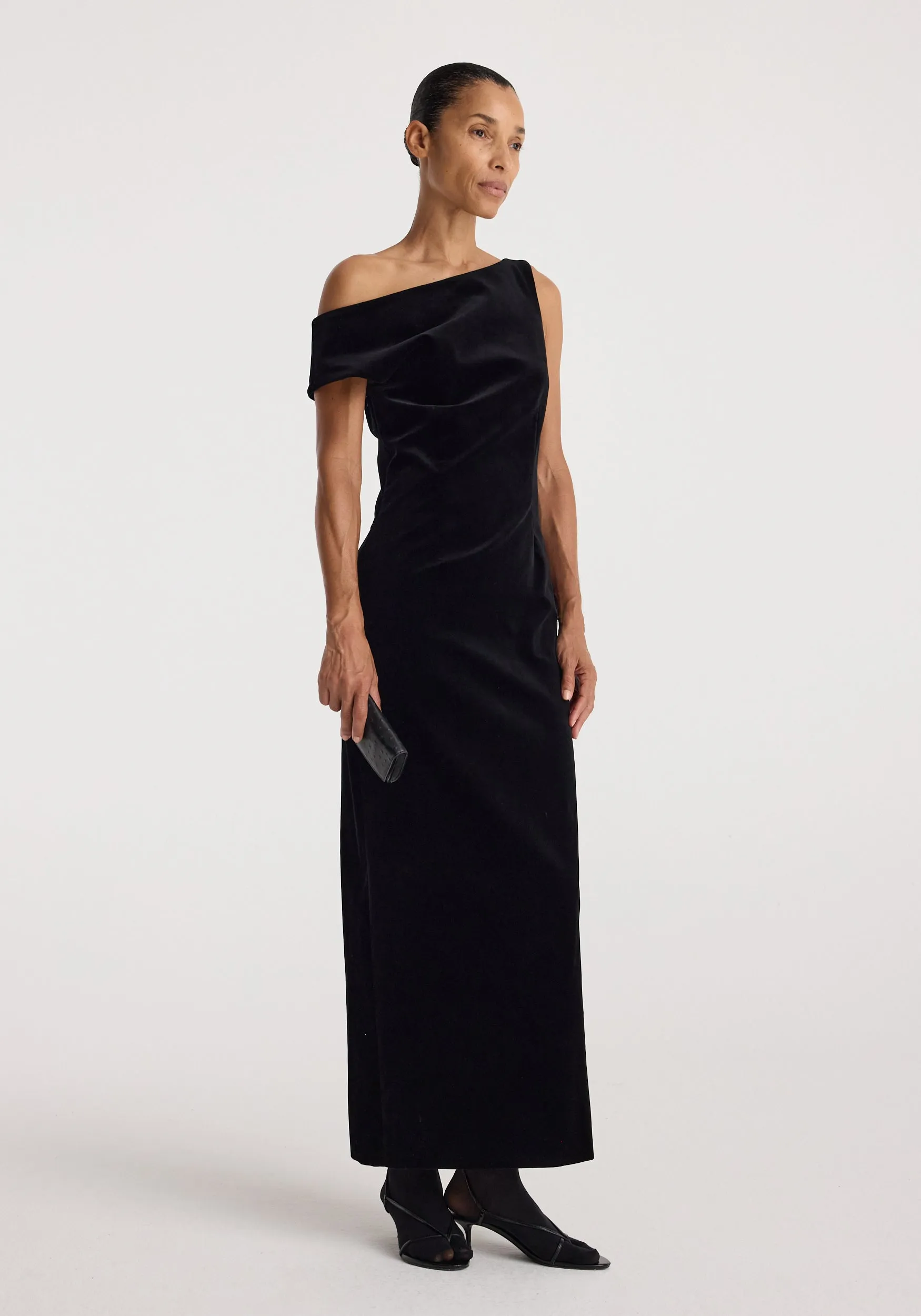 Sculptural off-shoulder velvet gown | black sold by Rohe