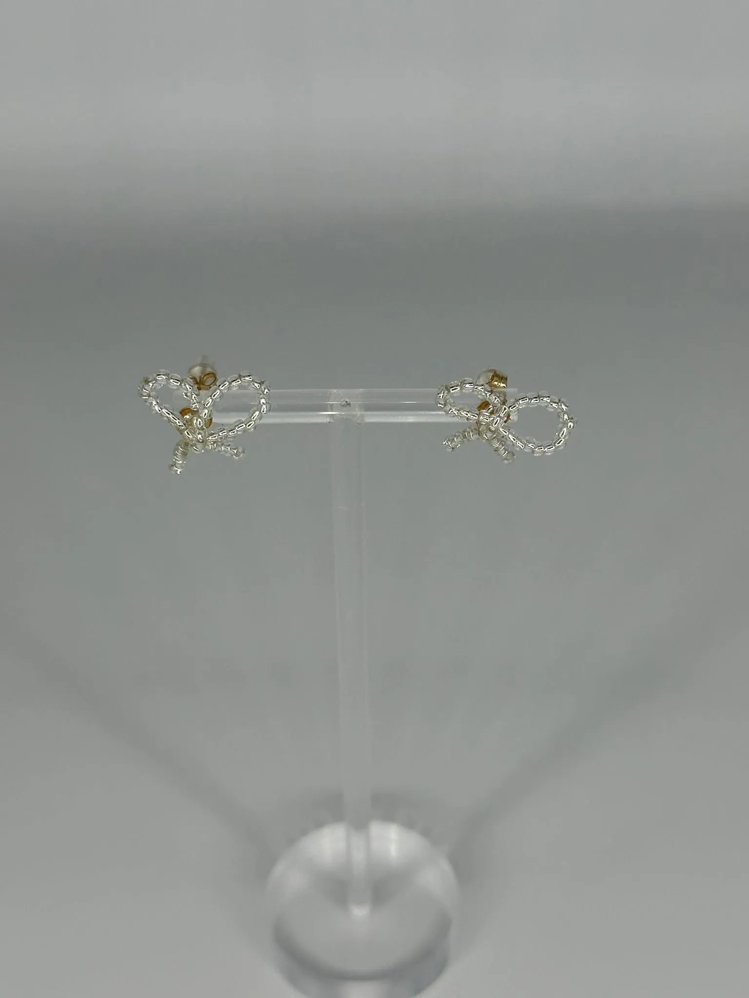 SAMPLE SALE PICCOLO BOW EARRING SILVER sold by Labro