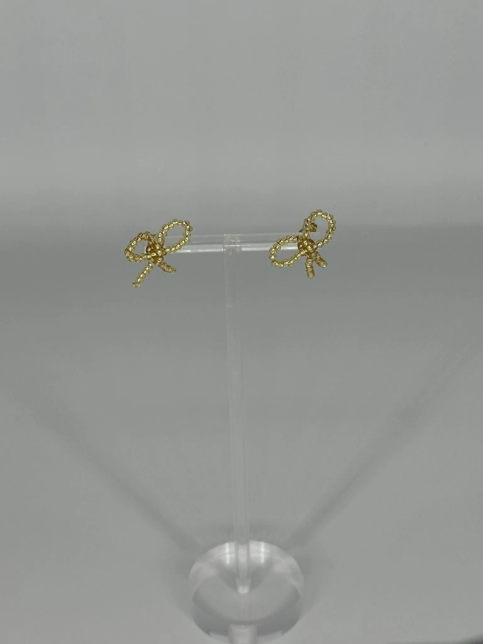 SAMPLE SALE PICCOLO BOW EARRING GOLD sold by Labro