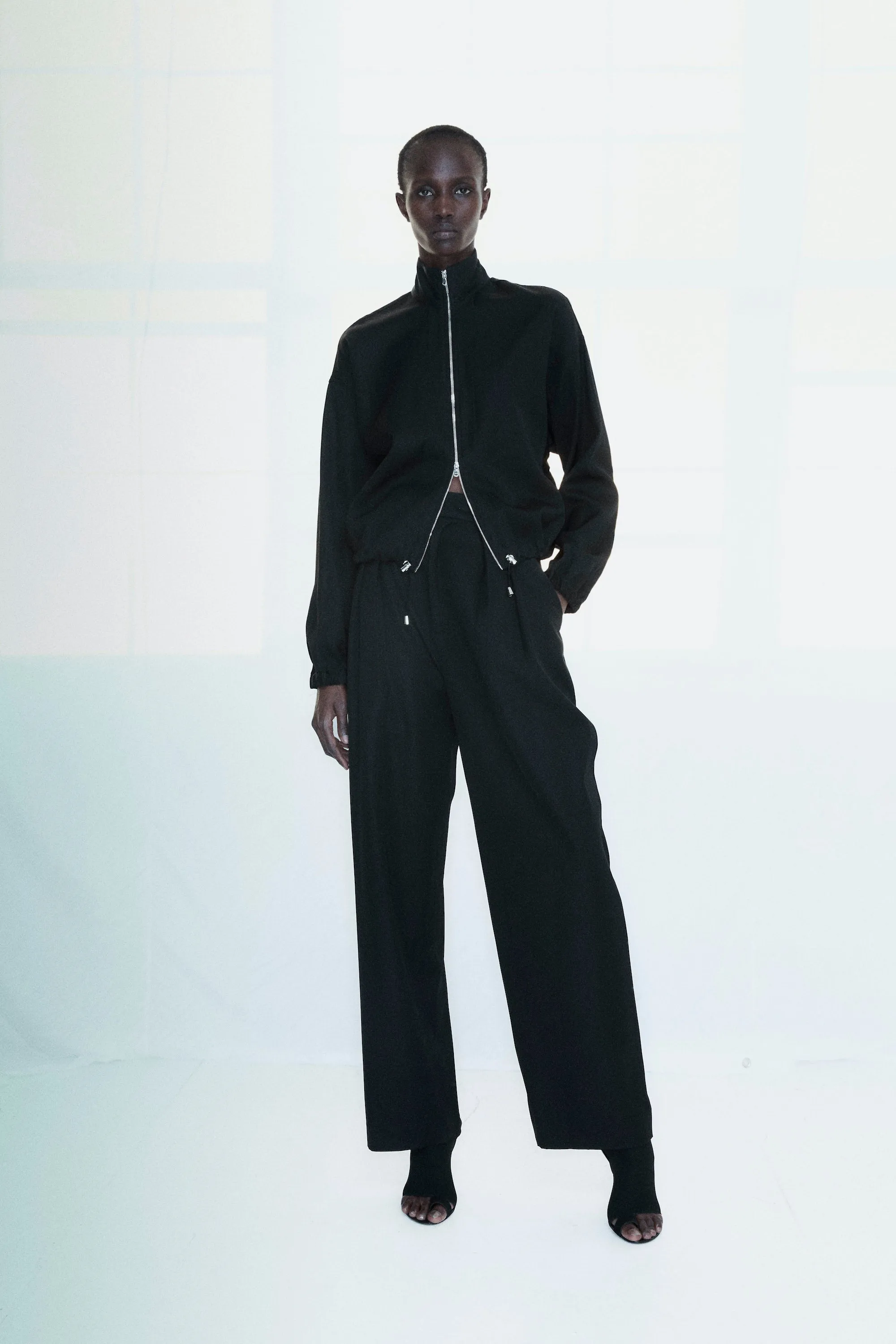Wide Leg Pleated Trouser - Black sold by NOMIA