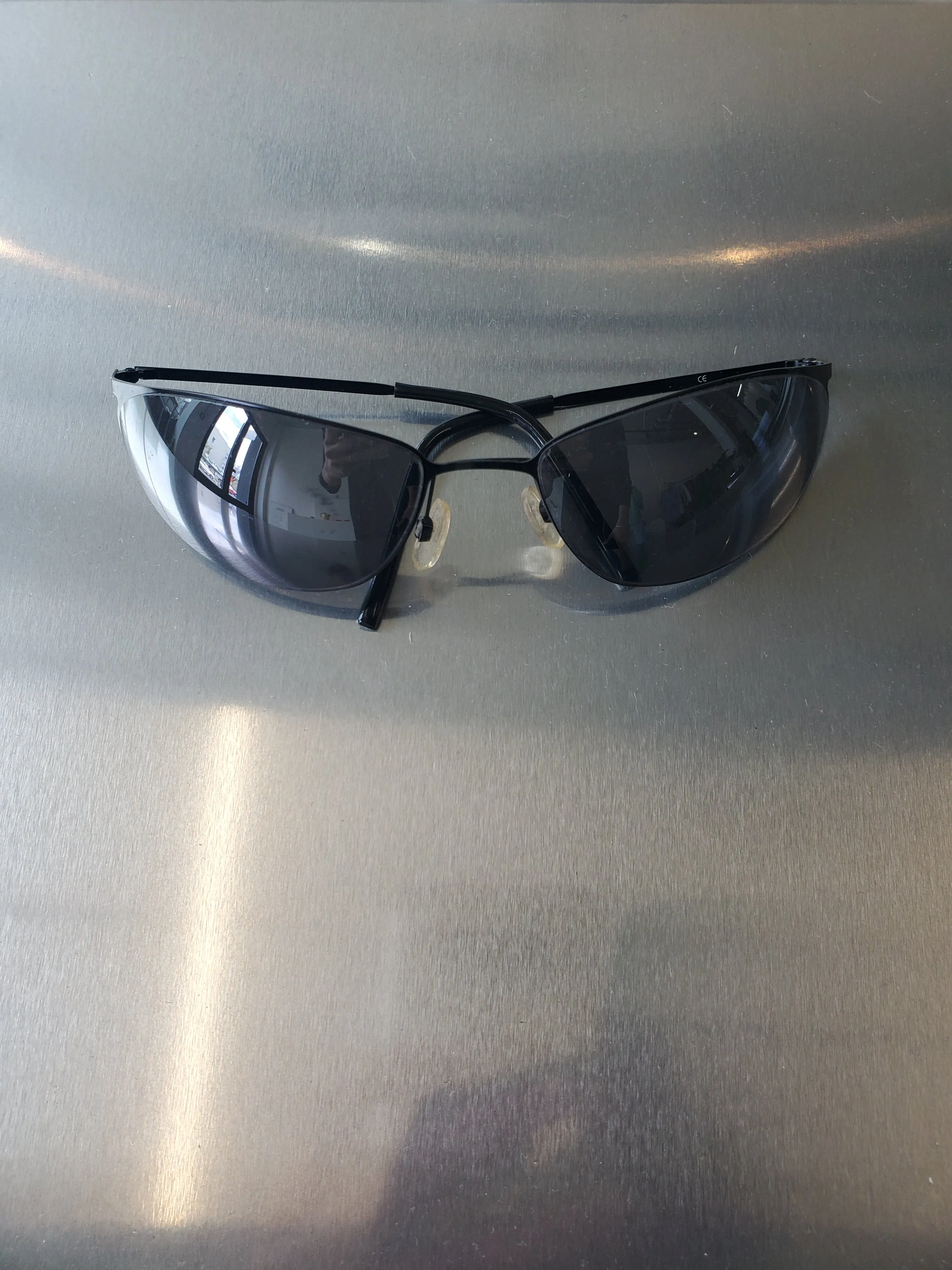 Vintage Italian Sunglasses - Black metal wraparound sold by NOMIA