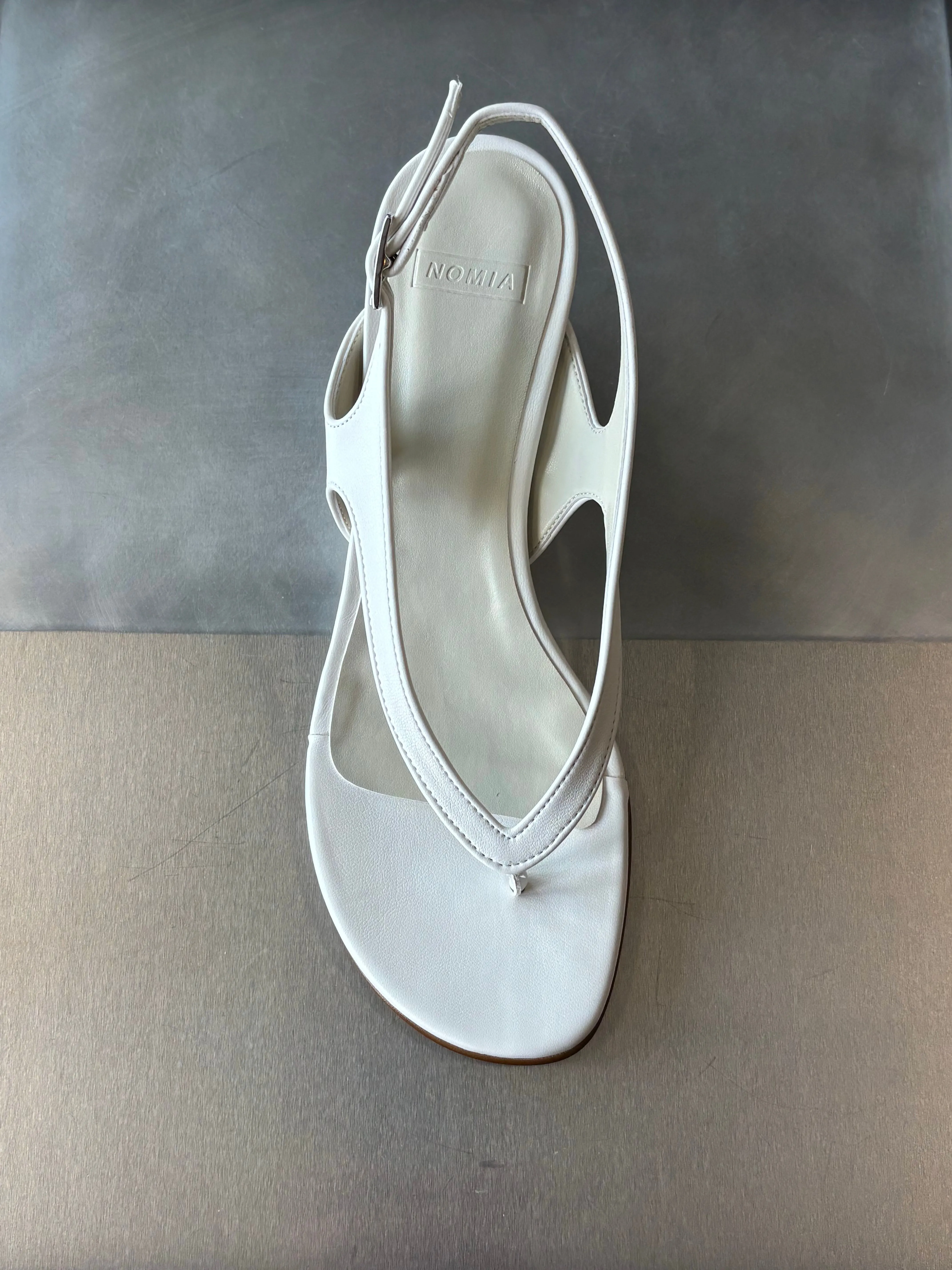 Lela Thong Wedge - White sold by NOMIA