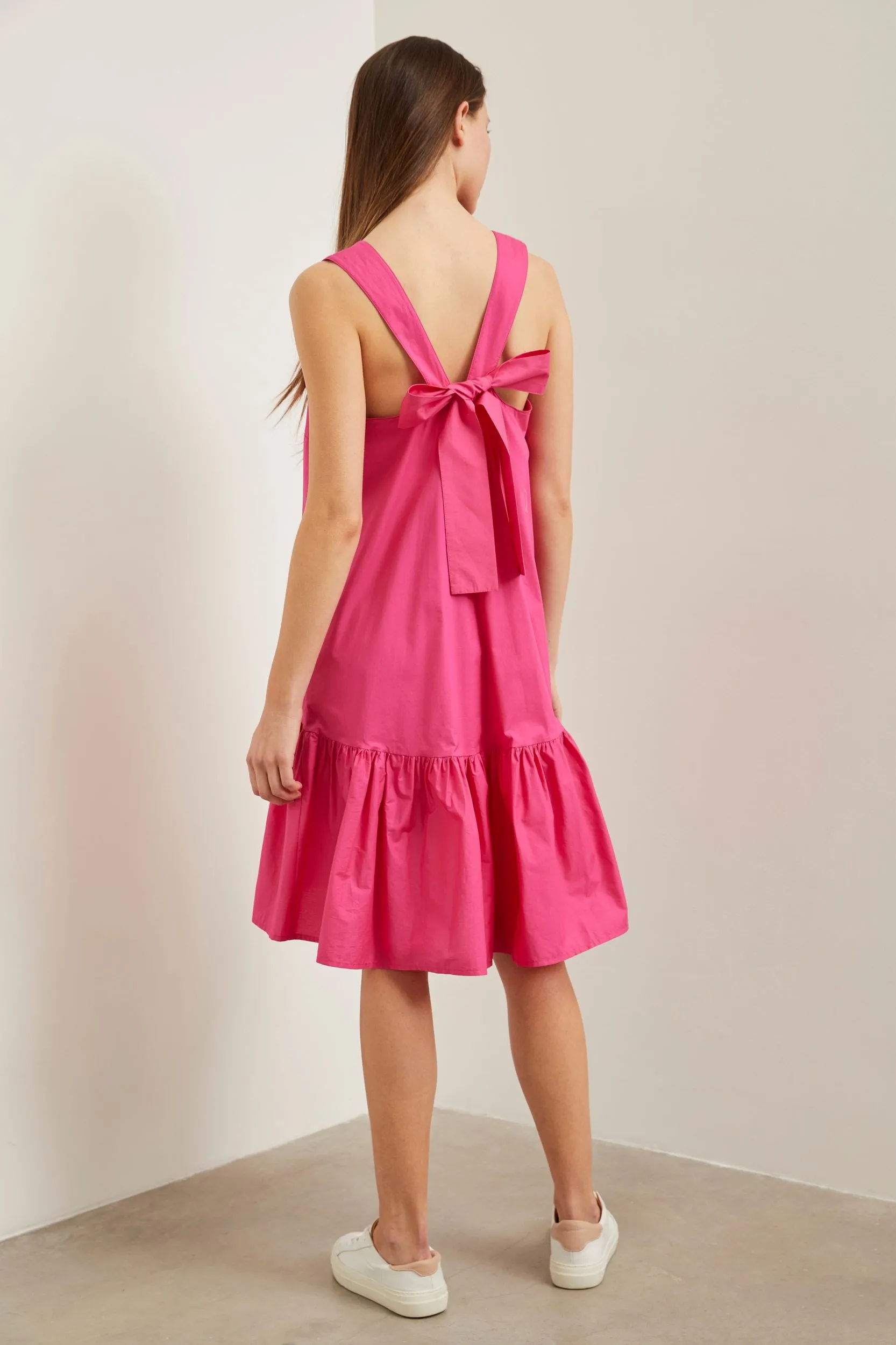 Dress with frill & bow at back sold by Tristan Style