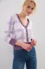 Plaid cardigan sold by Tristan Style