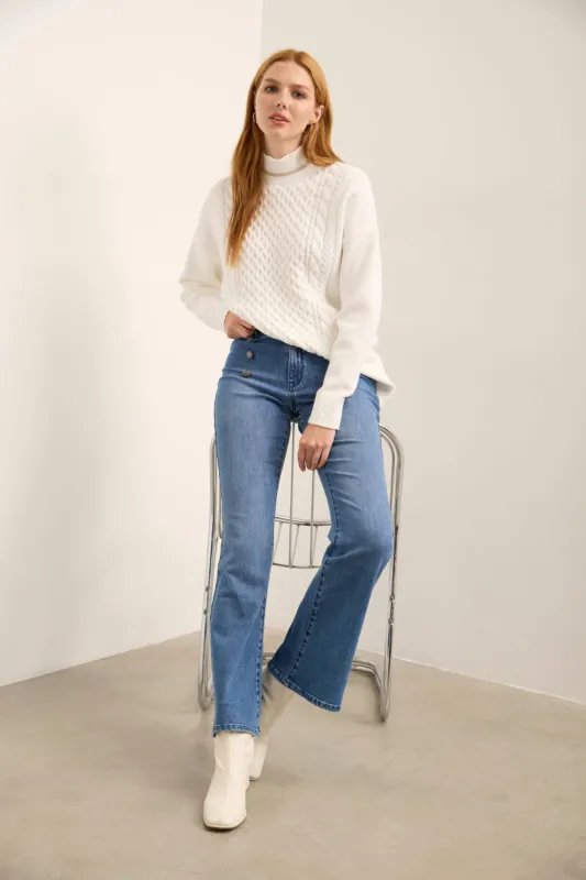 Flared high waisted button jeans sold by Tristan Style
