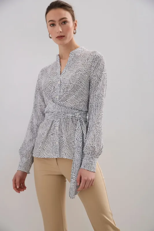 Polka dot wrap blouse sold by Tristan Style