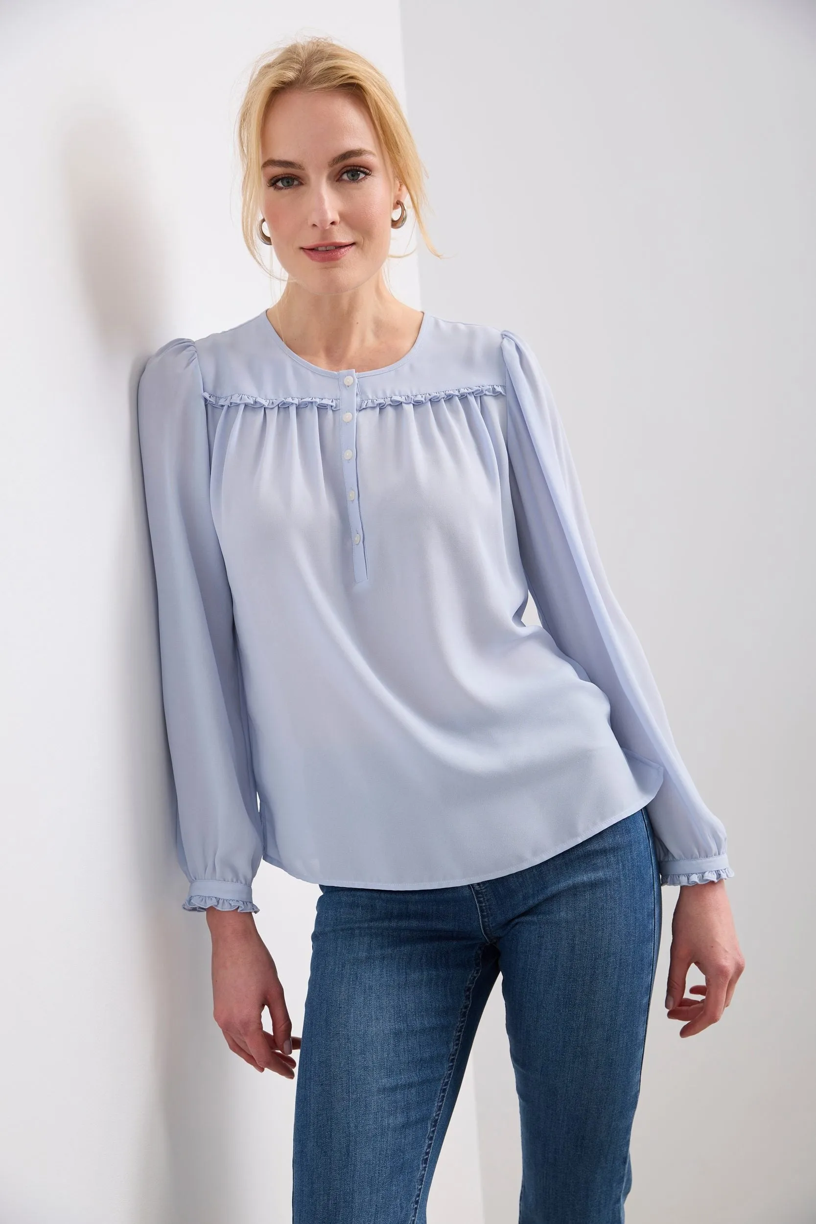 Blouse with frill and buttons in the front sold by Tristan Style