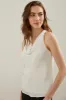 Sleeveless top with draped col sold by Tristan Style
