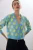 Oversized cardigan with lemon pattern sold by Tristan Style